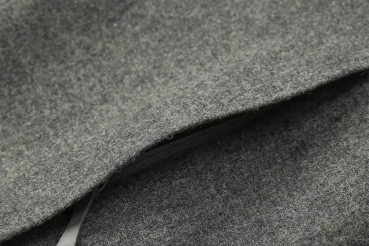 Grey wool-blend fabric with a welt pocket - 3m scotchlite reflective fabric: A B2B Guide for Outdoor Jacket Brands (2026)