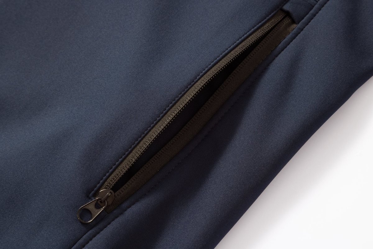 Welted zip pocket on a navy softshell - Dog Raincoat Manufacturer Taped Seam: Your 2026 Sourcing Guide