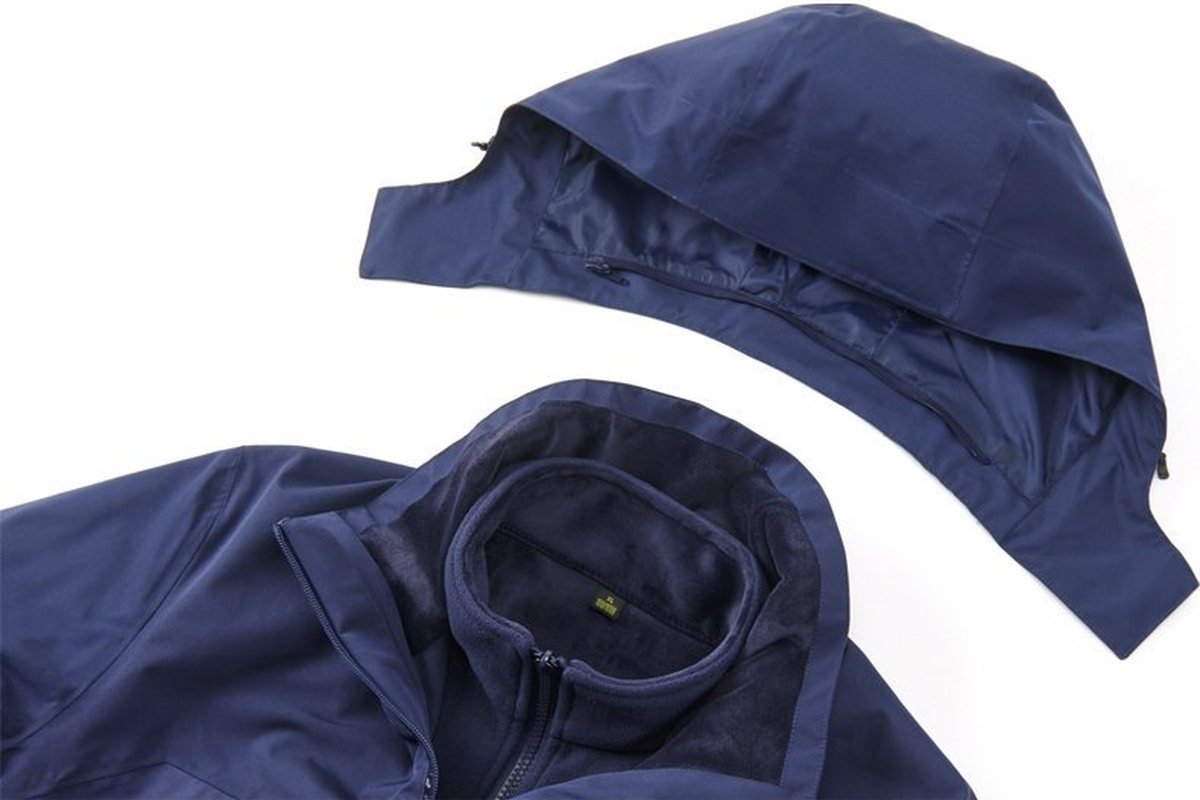Navy hardshell with its detachable hood laid flat - Helmet Compatible Hood Construction (2026 Guide)