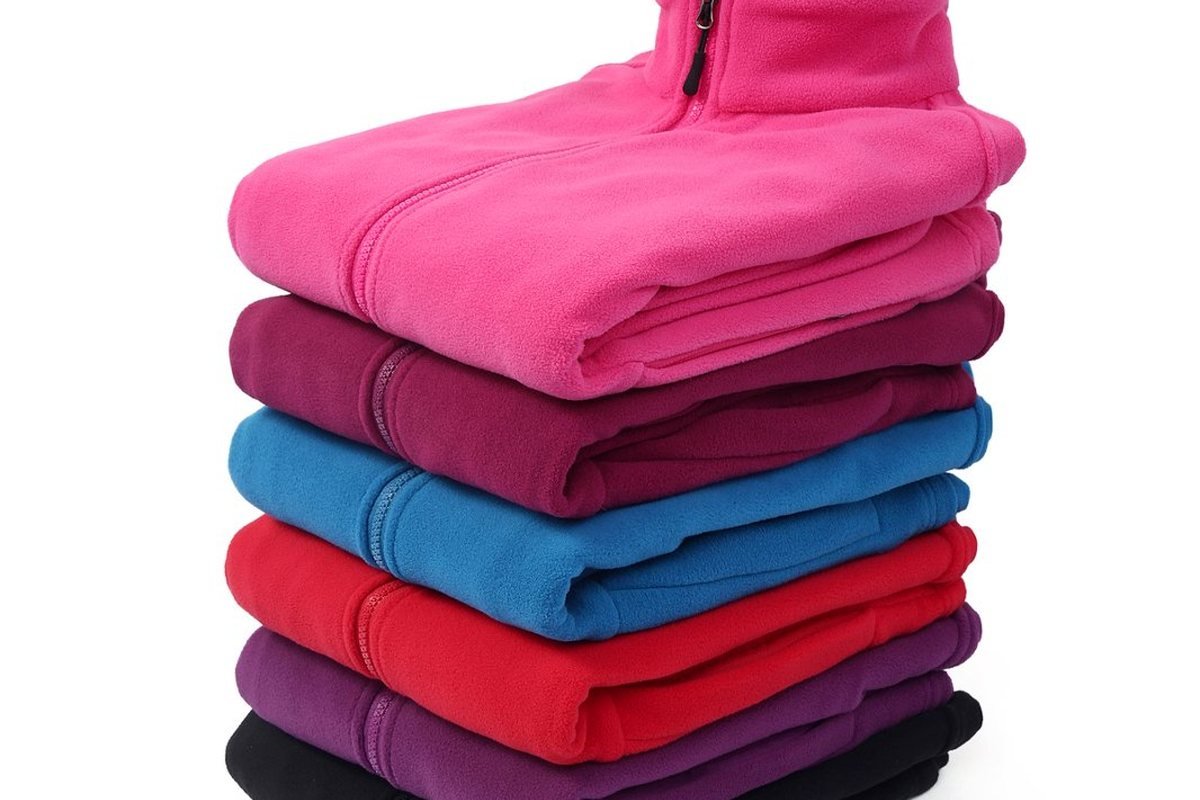 Finished fleece jackets stacked by colourway - Low MOQ Pet Outerwear Sourcing: How Emerging Premium Brands Get Technical Dog