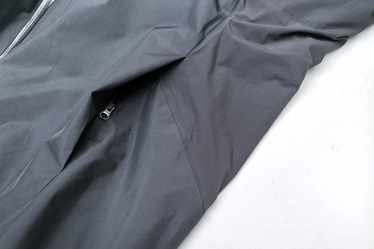 Down-proof shell fabric on a grey insulated jacket - PrimaLoft vs Thinsulate vs Coreloft: Synthetic Insulation Compared