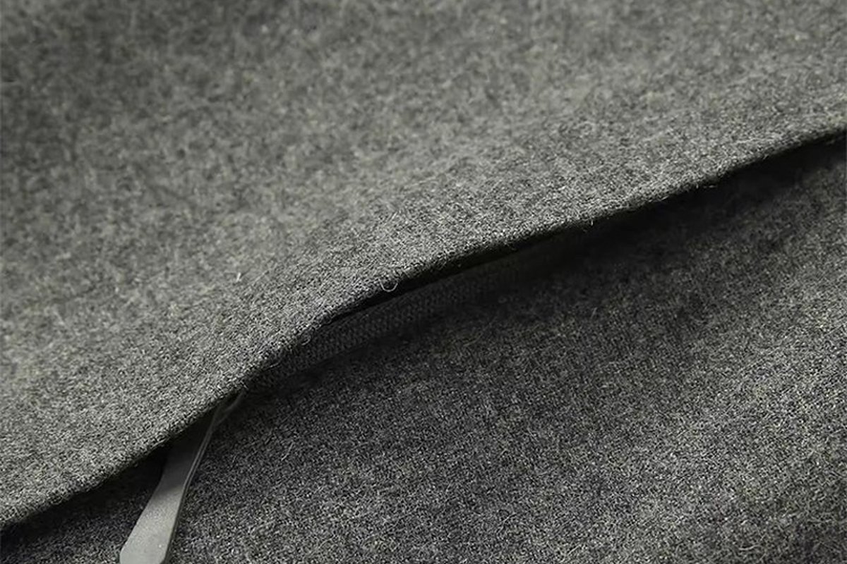 Grey wool-blend fabric with a welt pocket - Reflective vs 3M Scotchlite: Choosing Hi-Vis Safety Fabric