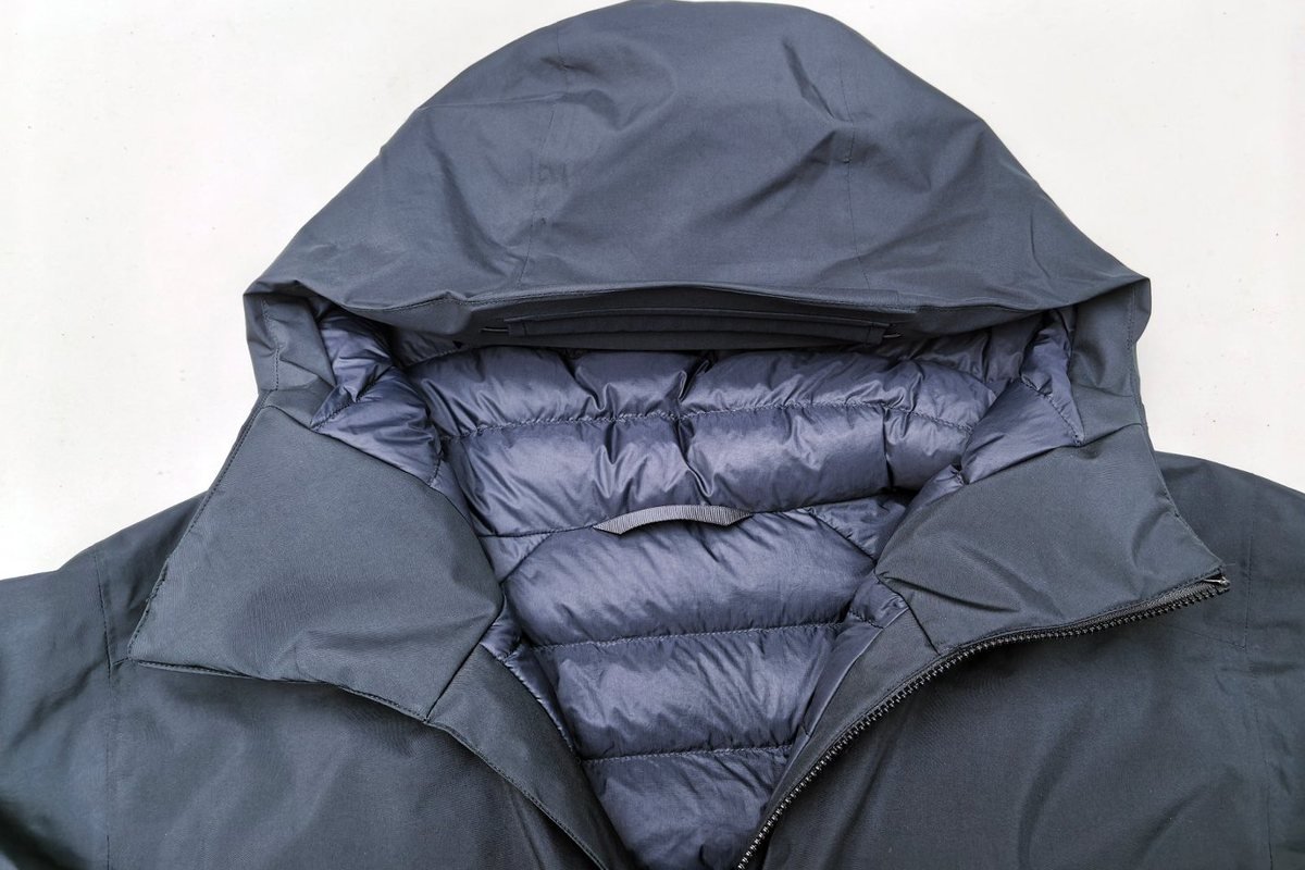 Grey hooded down jacket showing baffle construction - Synthetic Insulation vs Down: Which Wins in Cold, Wet Conditions