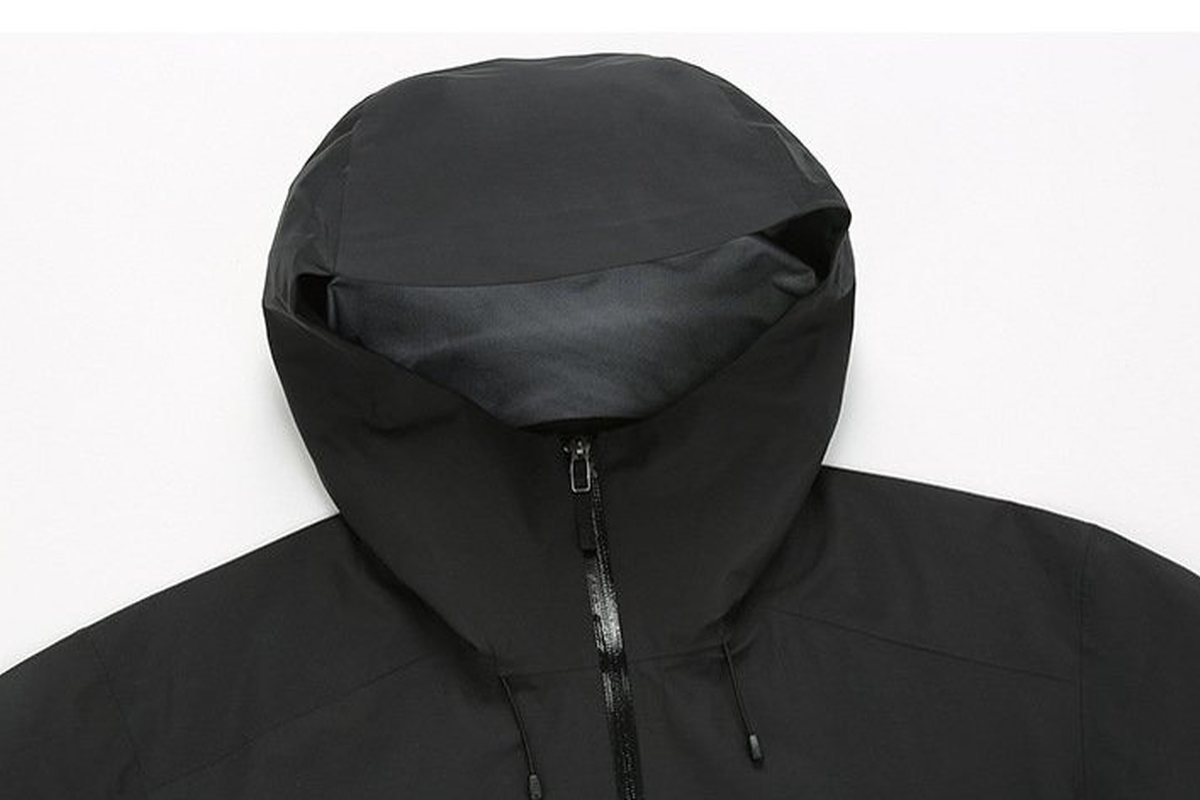 Hood and collar of a black hardshell jacket - Water Column Waterproof Rating: ISO 811 Guide (2026)