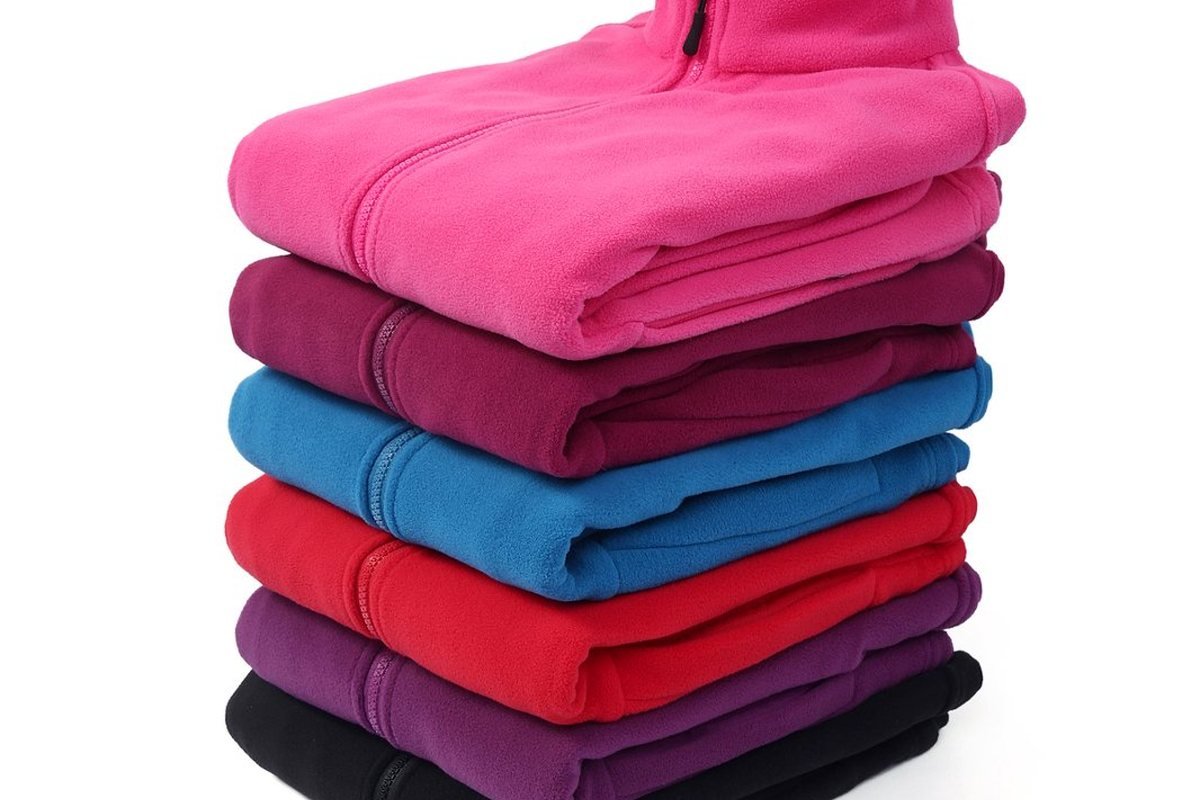 Finished fleece jackets stacked by colourway - Waterproof Jacket Wholesaler: B2B Bulk Pricing Guide 2026