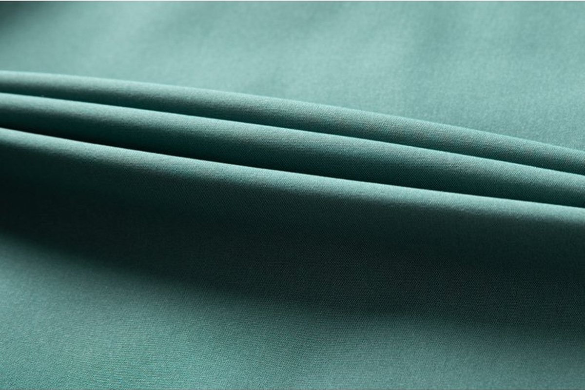 Teal softshell fabric fold - What is Ripstop Fabric? How the Grid Weave Stops Tears